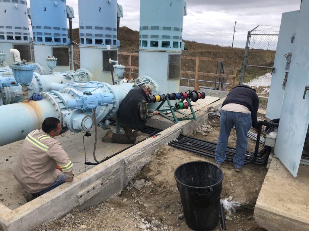 The Electrical Maintenance Department installs new conduit and wiring at the 7-1 Pumping Plant.